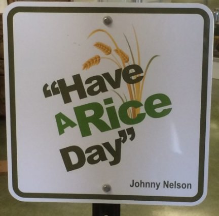 The late Mayor Johnny Nelson was known for his "Have a Rice Day" saying, which was reproduced for a sign at the heritage museum named in his honor.